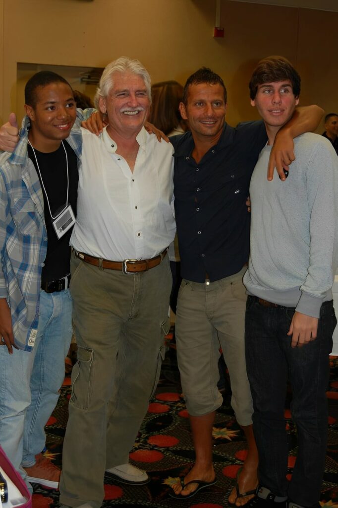 Nichlas Brandon standing with Dr. Morse and two other ISHA students