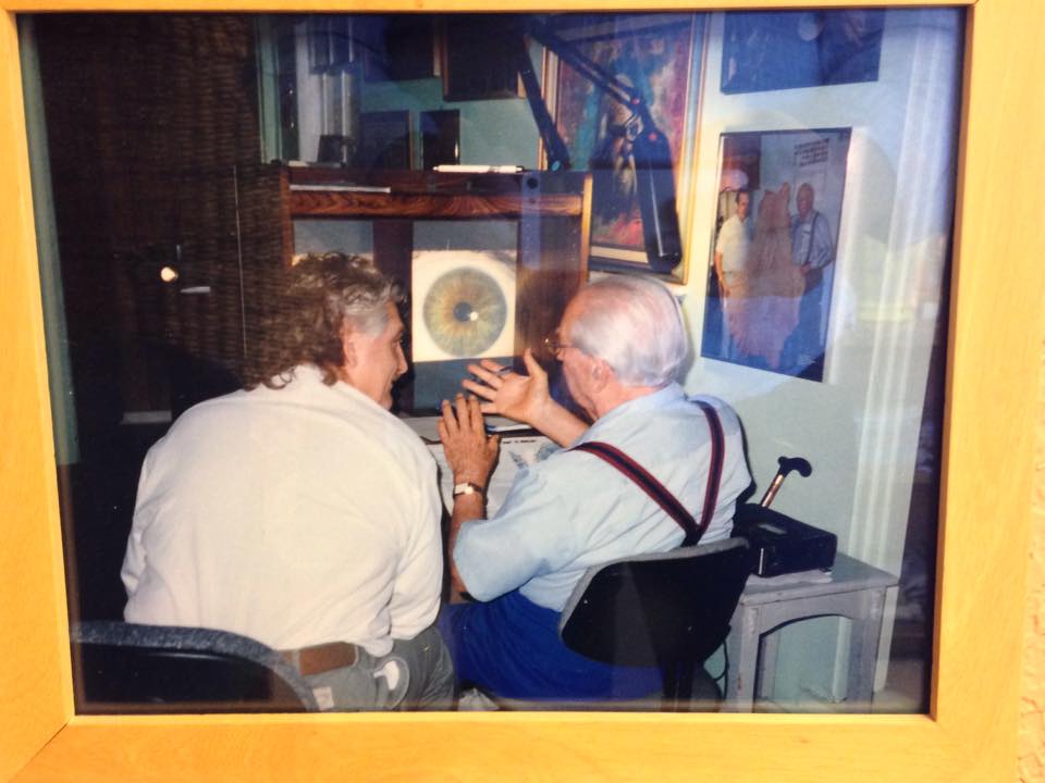 Dr. Robert Morse sitting with Dr. Bernard Jensen, discussing iridology.